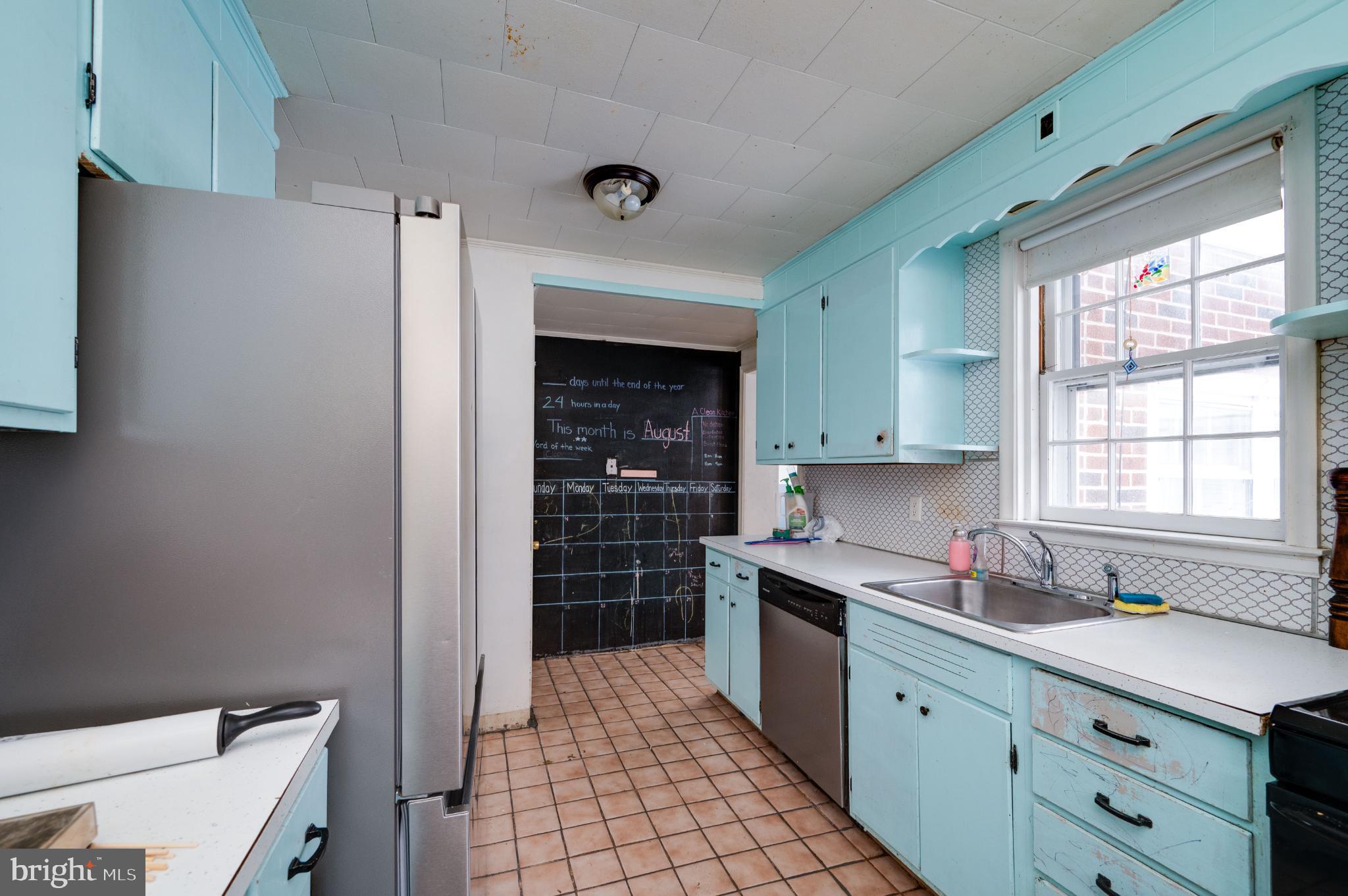 9 West 35th Street Reading, PA 19606 - Photo 25 of 52 a kitchen with stainless steel appliances a sink stove and cabinets
