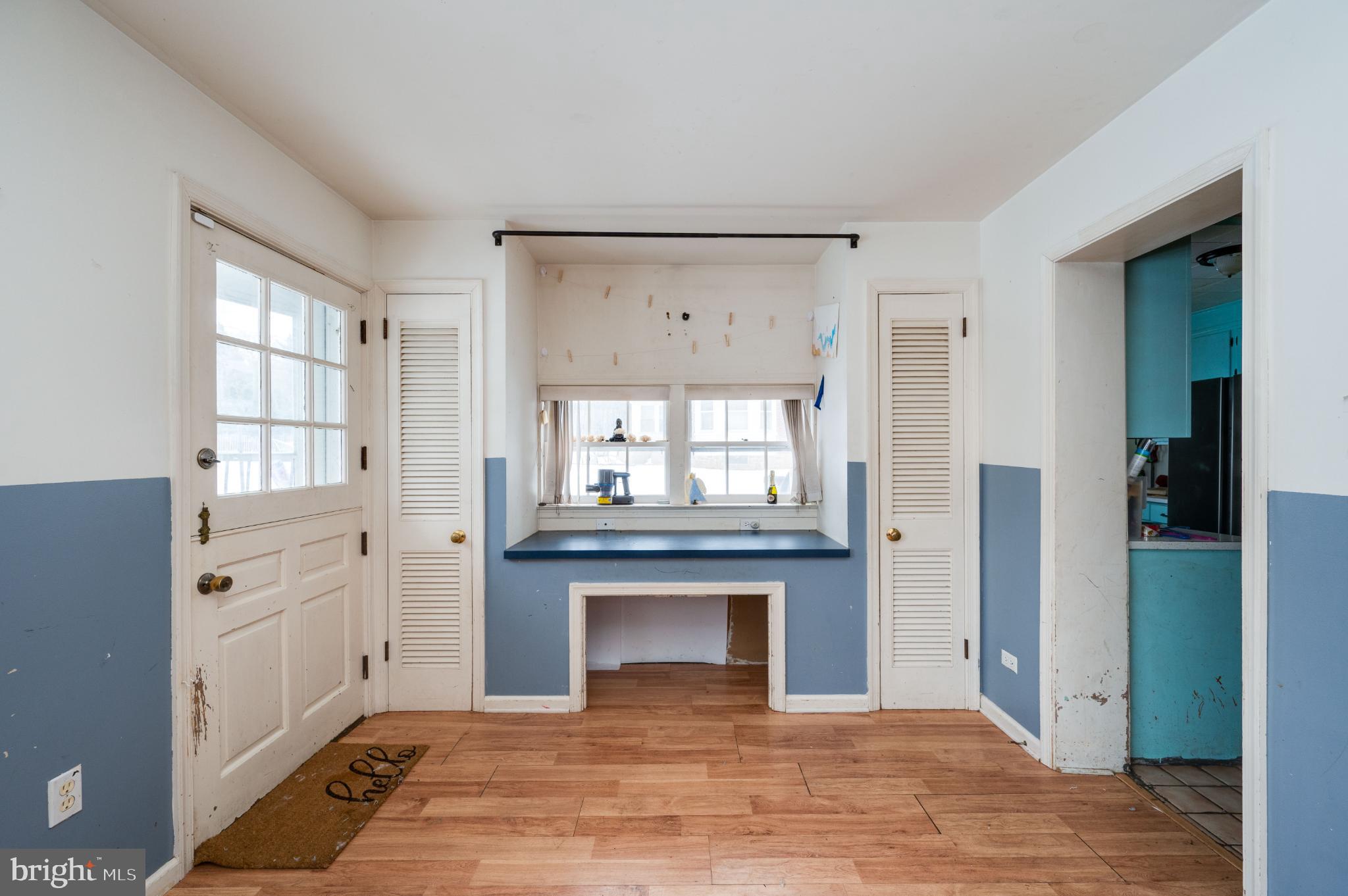 9 West 35th Street Reading, PA 19606 - Photo 27 of 52 a view of a hallway with a fireplace and windows