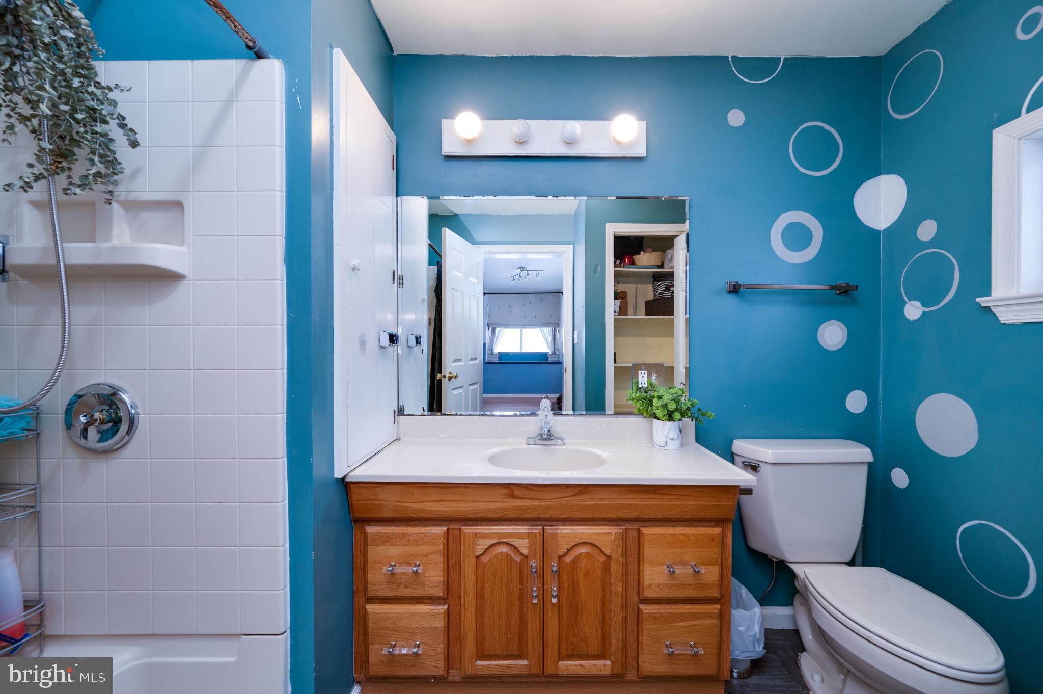 9 West 35th Street Reading, PA 19606 - Photo 29 of 52 a bathroom with a granite countertop toilet sink and mirror