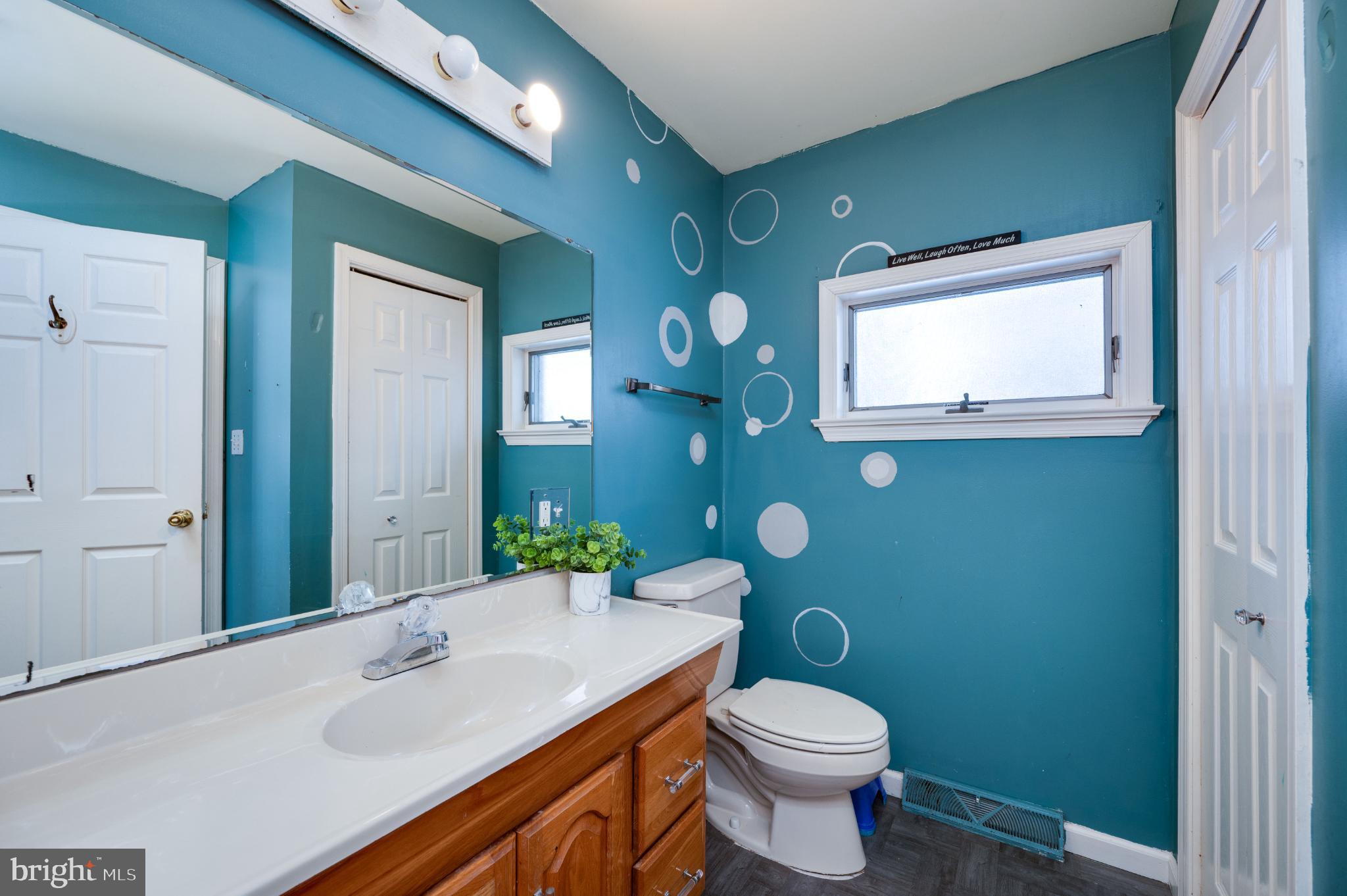 9 West 35th Street Reading, PA 19606 - Photo 30 of 52 a bathroom with a sink a toilet and mirror