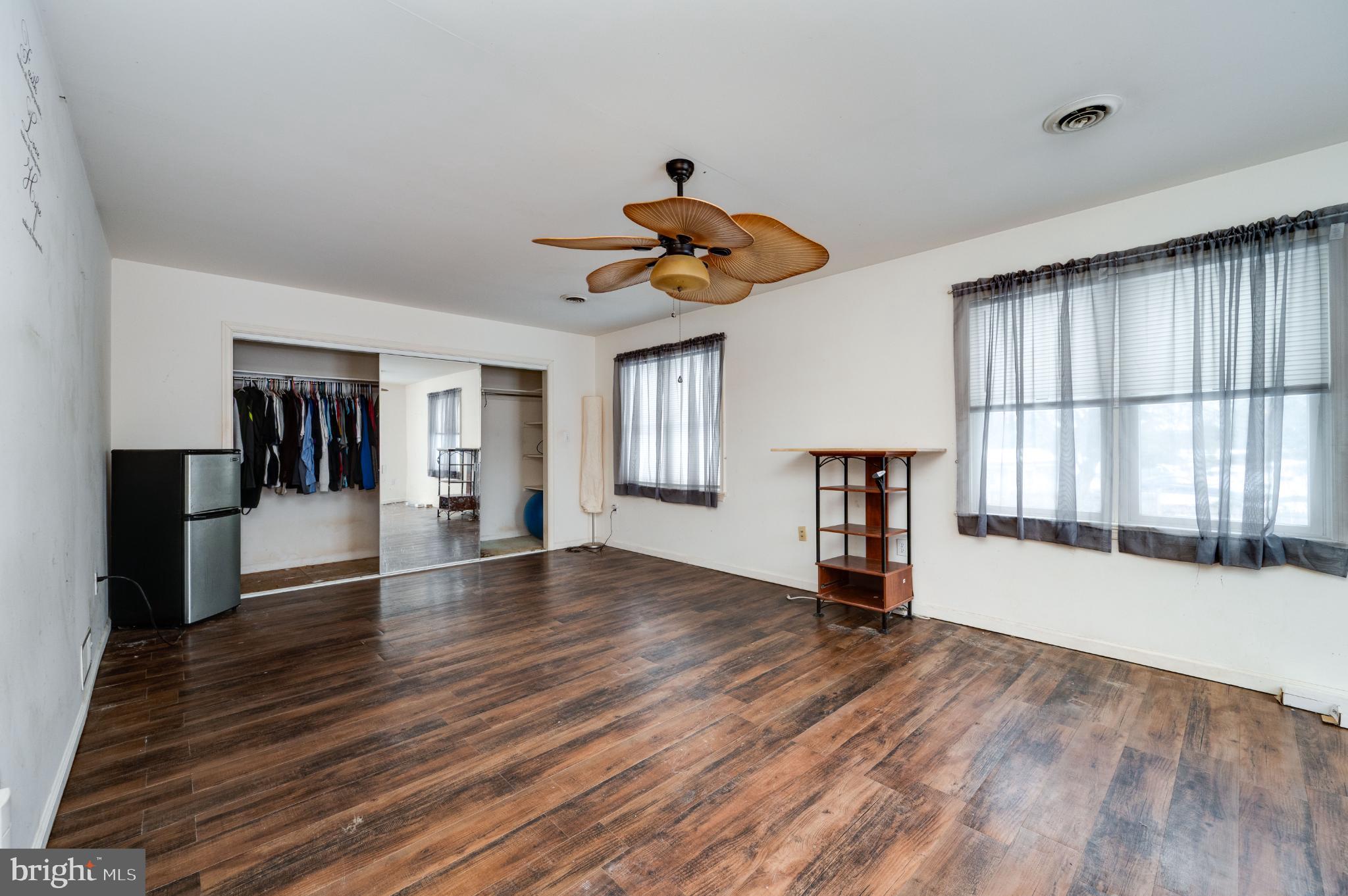 9 West 35th Street Reading, PA 19606 - Photo 33 of 52 a view of empty room with wooden floor and fan