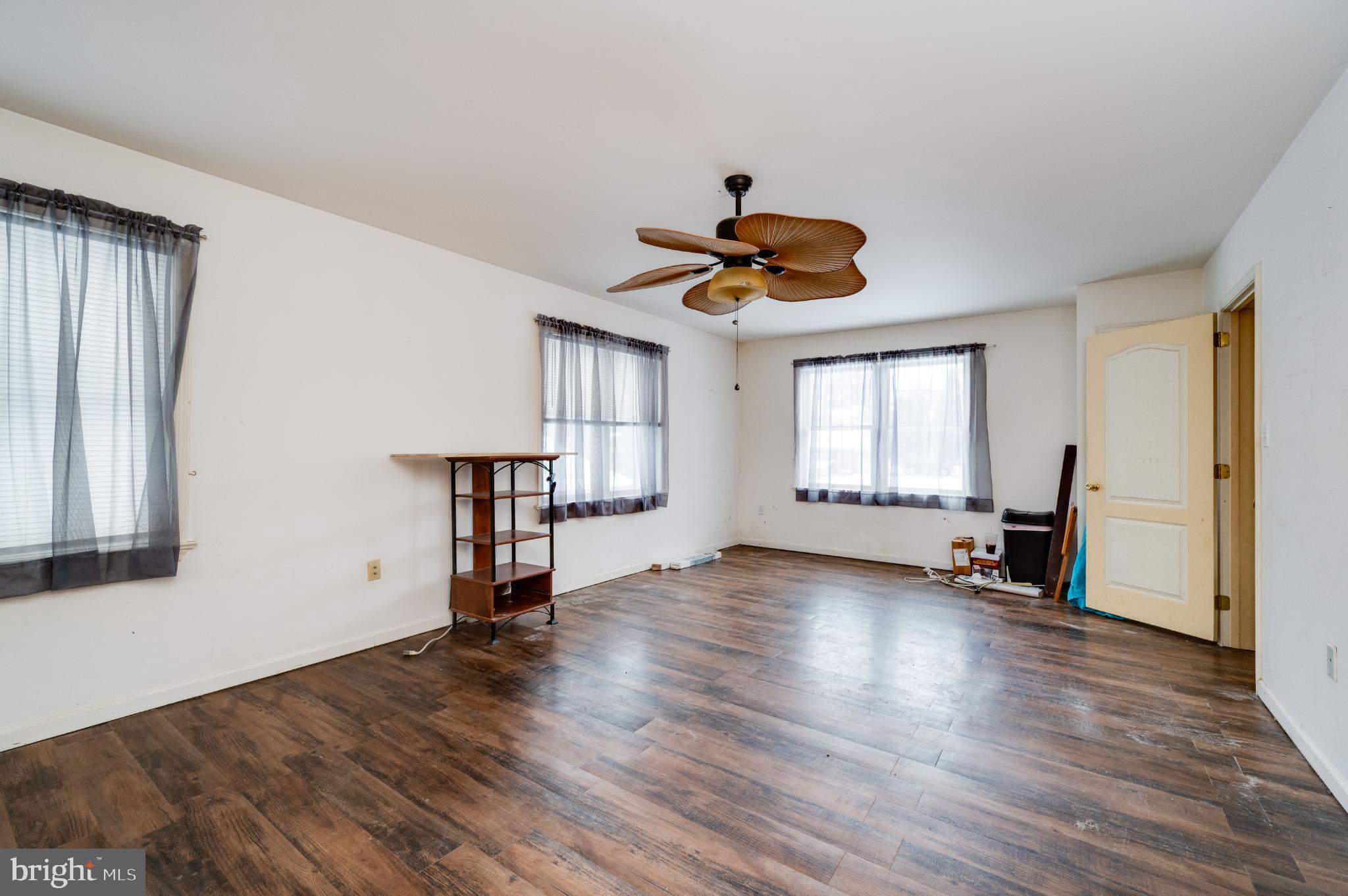 9 West 35th Street Reading, PA 19606 - Photo 35 of 52 a view of an empty room with wooden floor and a window
