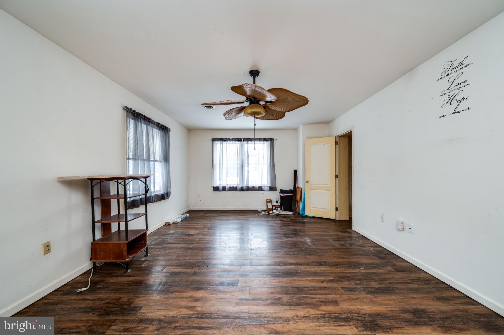 9 West 35th Street Reading, PA 19606 - Photo 36 of 52 a view of empty room with wooden floor and fan