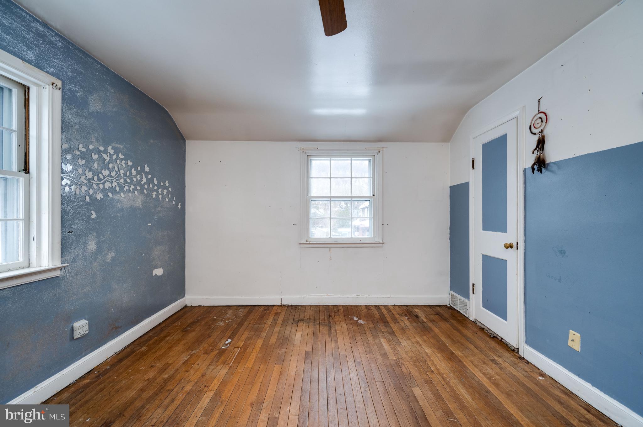 9 West 35th Street Reading, PA 19606 - Photo 39 of 52 a view of empty room with wooden floor and fan