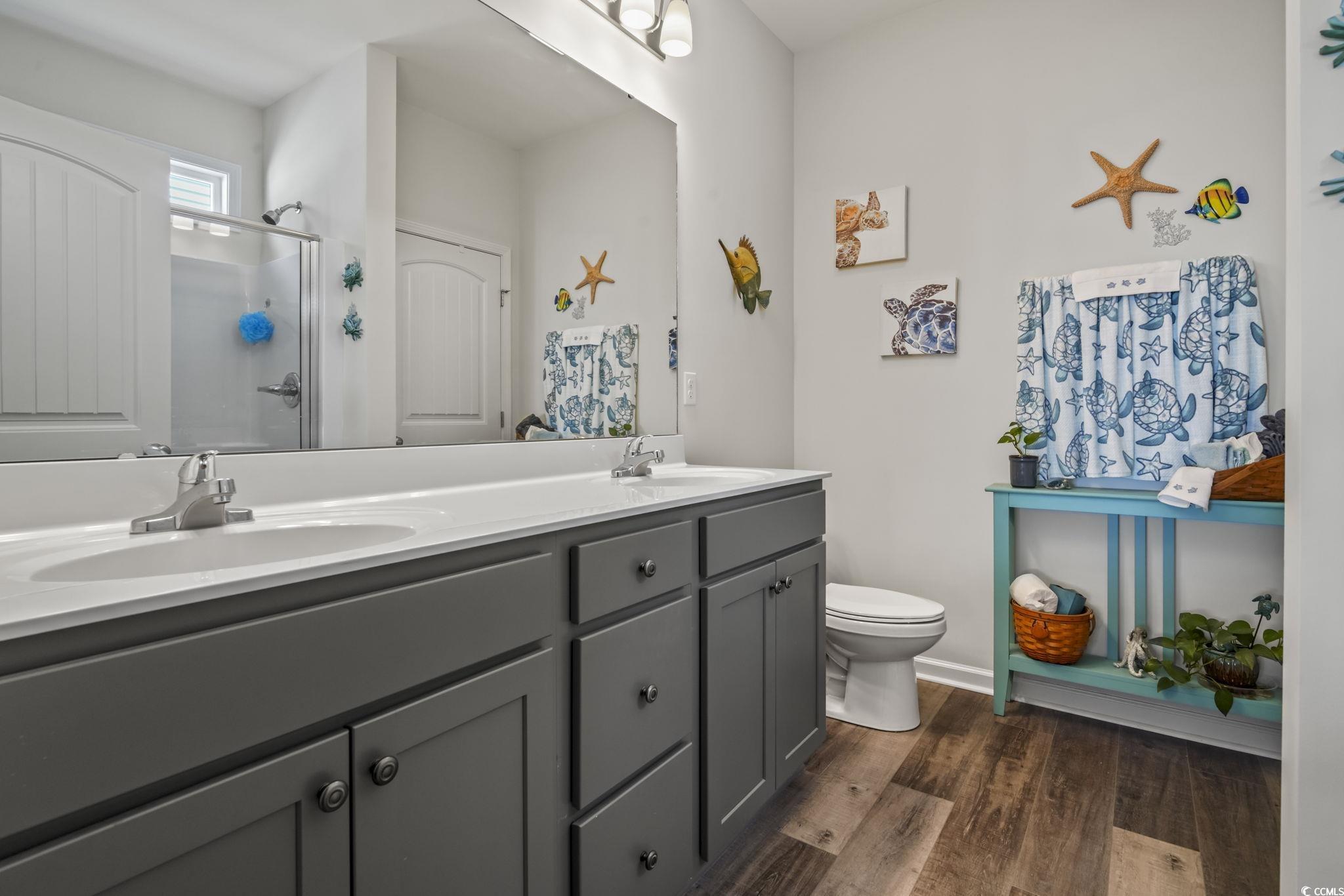 308 Concorde Drive Georgetown, SC 29440 - Photo 22 of 40 Primary Bathroom featuring double vanities, ample cabinetry, great shower and linen closet