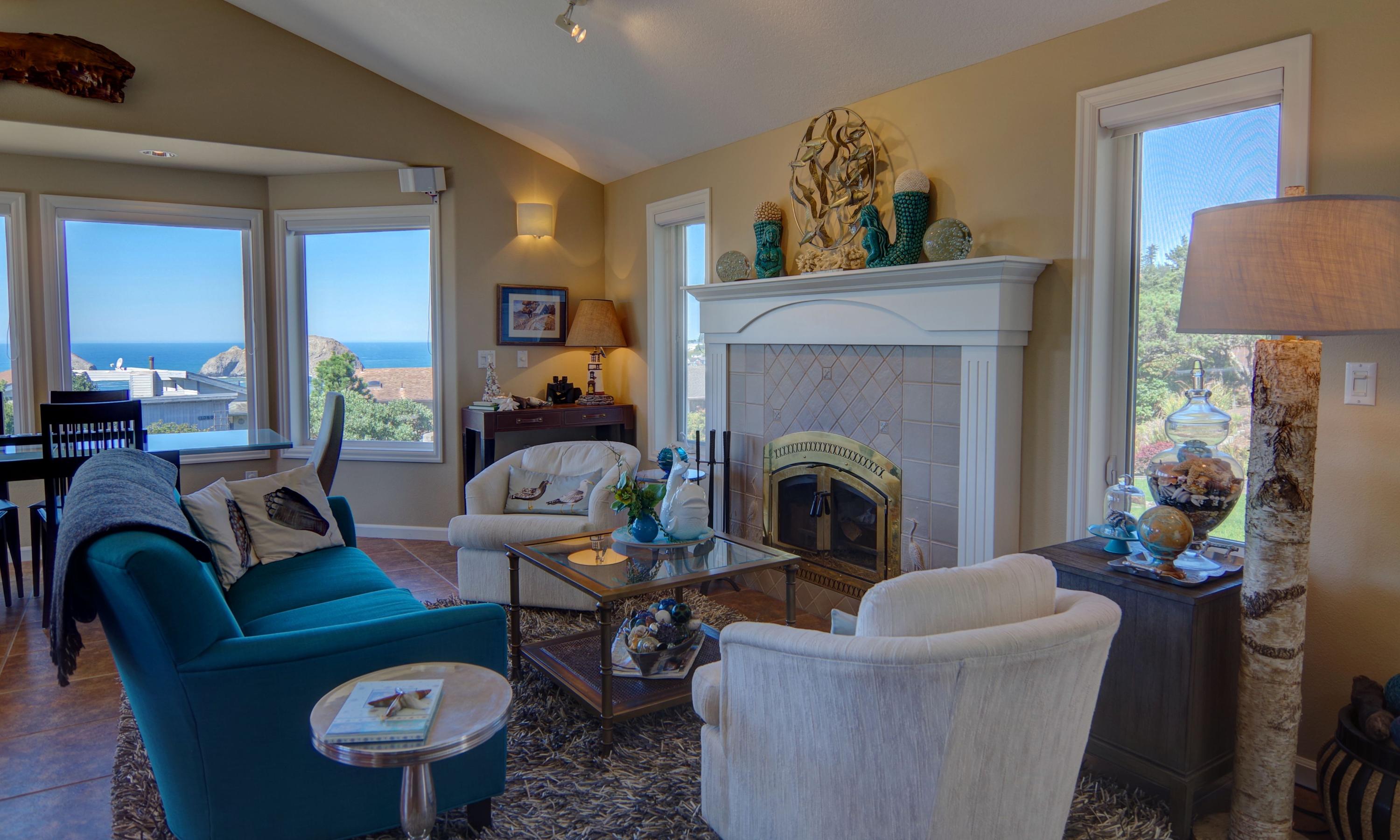 1065 Arthurs Road Oceanside, OR 97141 - Photo 9 of 47 a living room with furniture a lamp and a fireplace