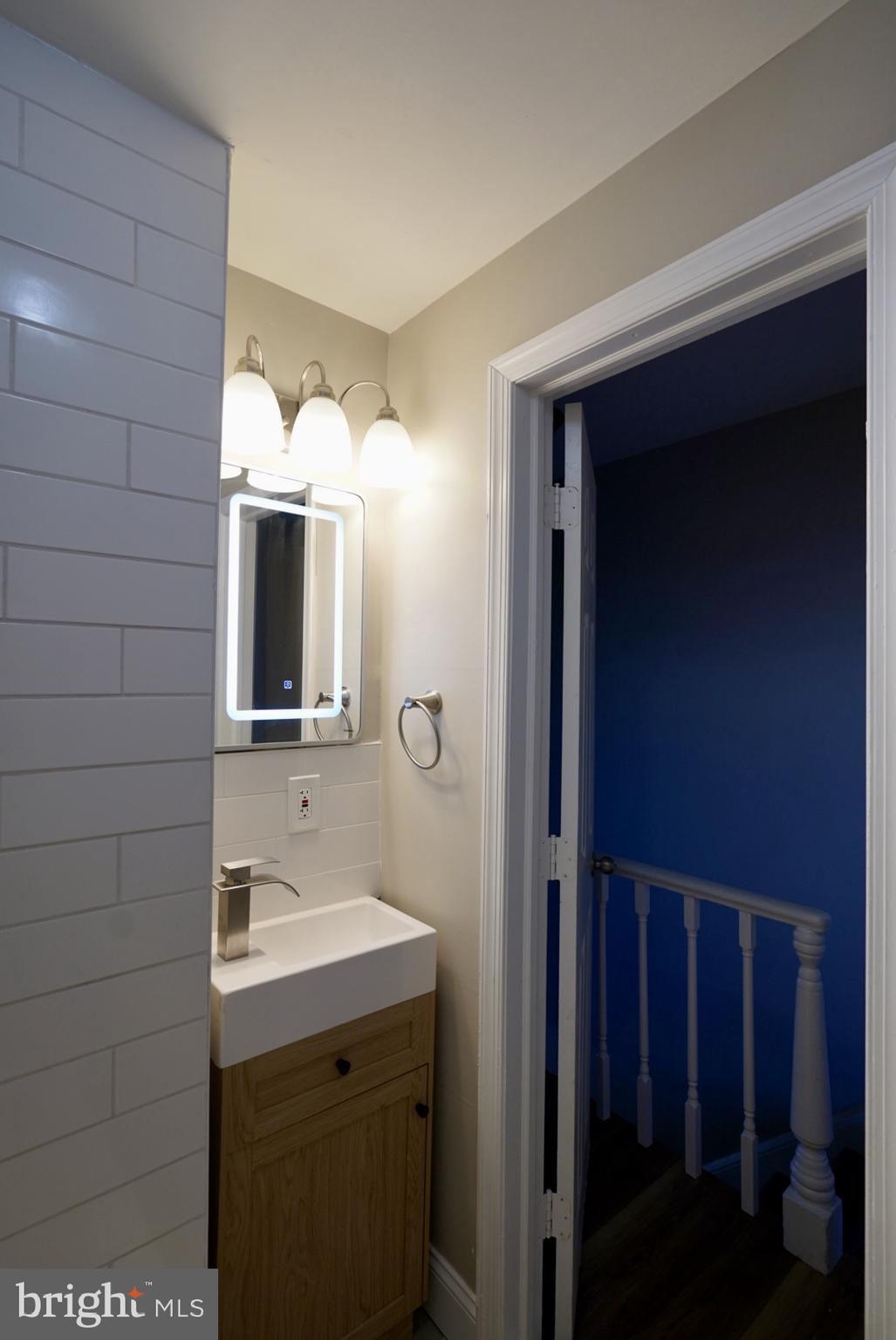2655 Cedar Street Philadelphia, PA 19125 - Photo 11 of 19 a bathroom with a sink and mirror