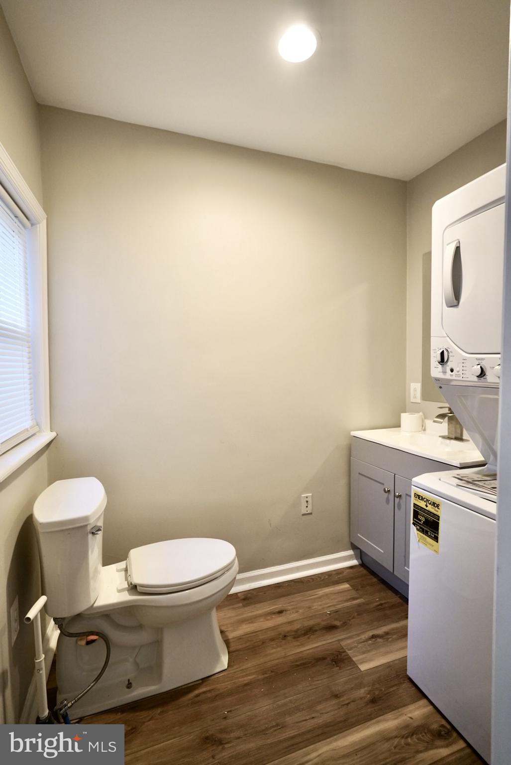 2655 Cedar Street Philadelphia, PA 19125 - Photo 15 of 19 a bathroom with a toilet a sink and mirror