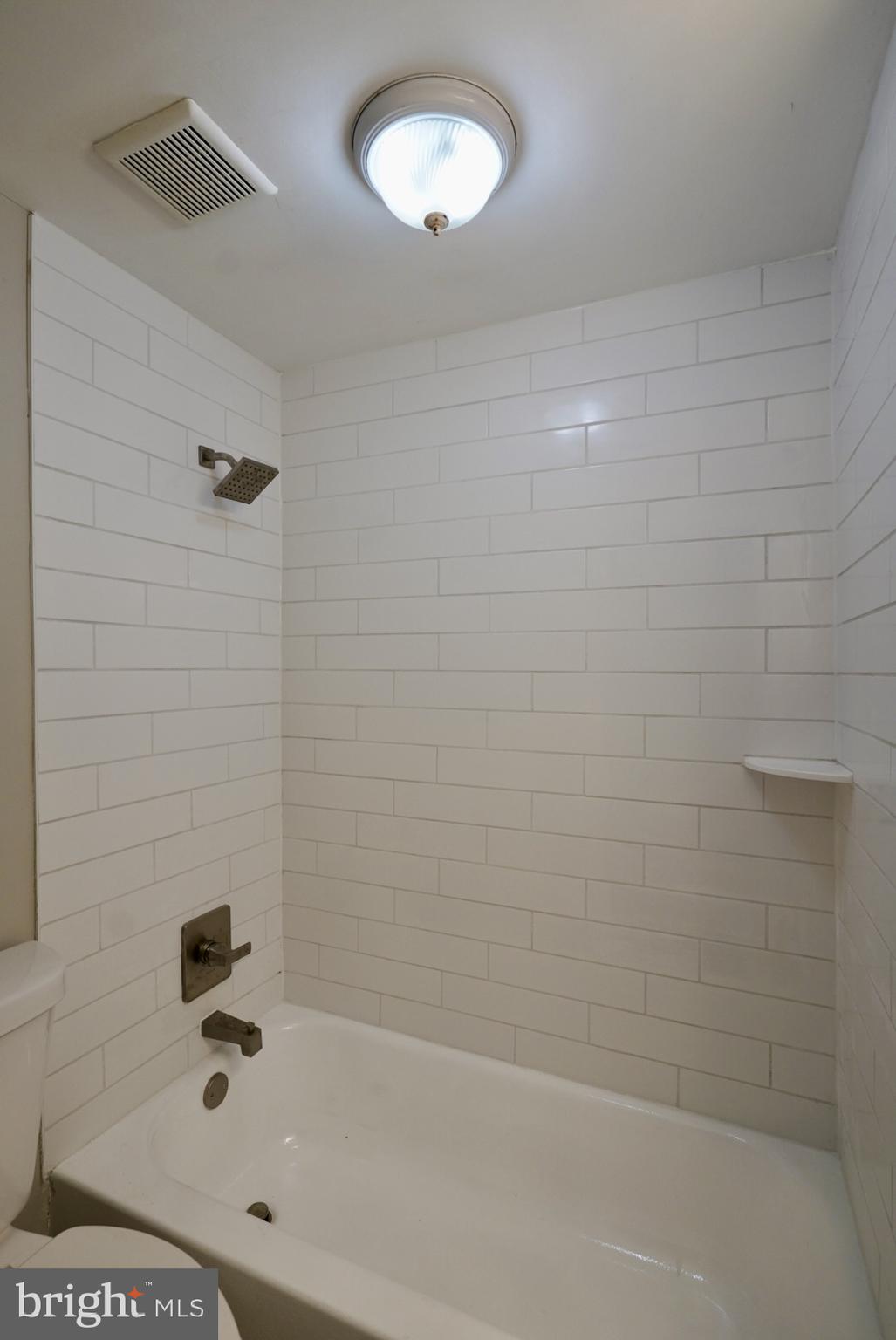 2655 Cedar Street Philadelphia, PA 19125 - Photo 17 of 19 a bathroom with a bathtub