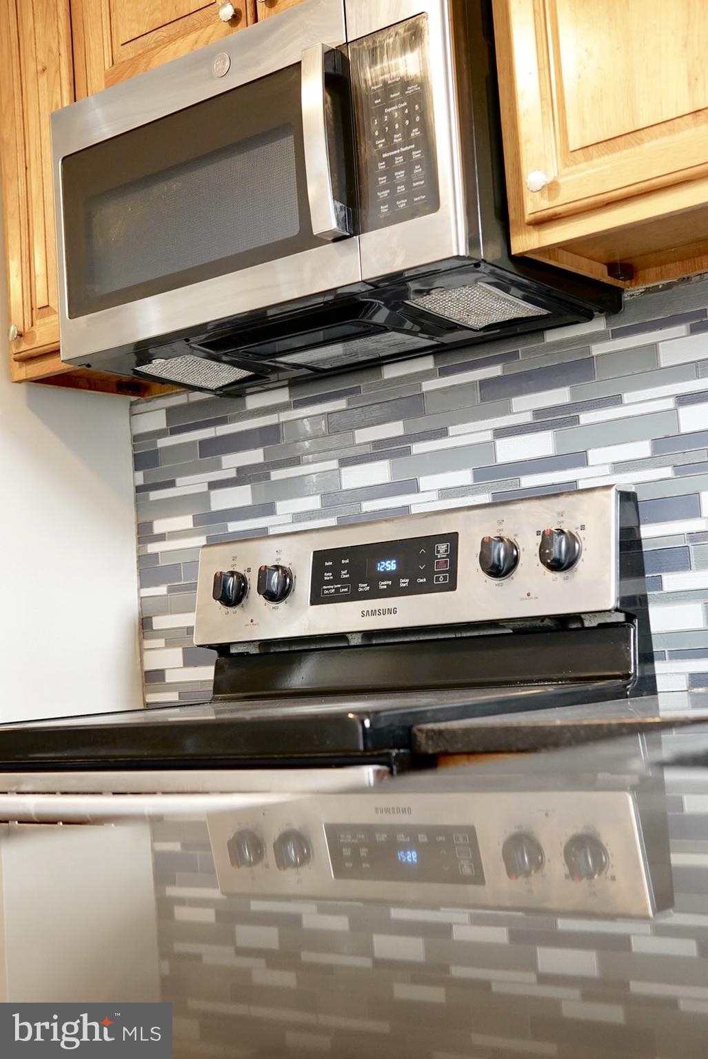 2655 Cedar Street Philadelphia, PA 19125 - Photo 4 of 19 a stove top oven sitting inside of a kitchen