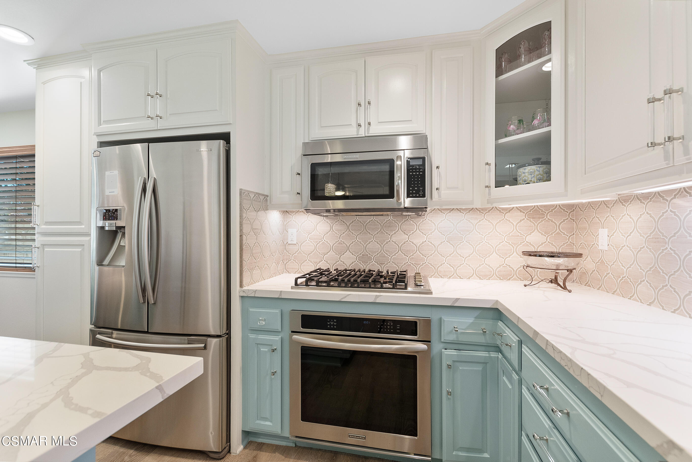 2835 Topaz Avenue Simi Valley, CA 93063 - Photo 13 of 42 a kitchen with stainless steel appliances granite countertop a stove a refrigerator and a microwave