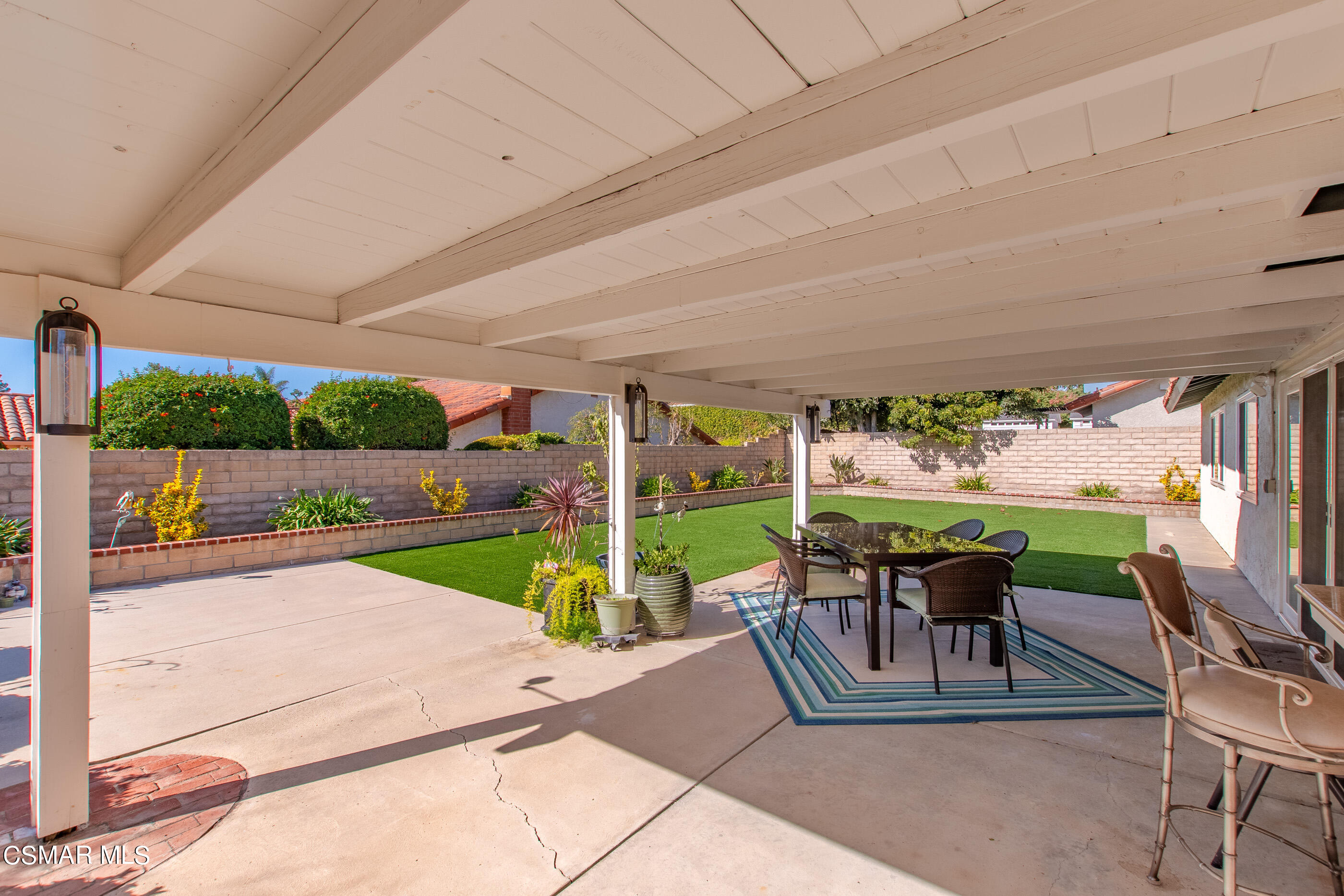 2835 Topaz Avenue Simi Valley, CA 93063 - Photo 30 of 42 a view of a patio with chairs and a yard