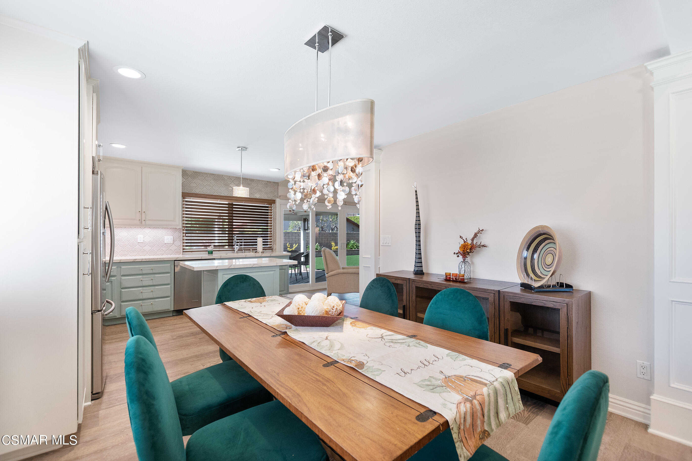 2835 Topaz Avenue Simi Valley, CA 93063 - Photo 8 of 42 a view of a dining room with furniture and a chandelier