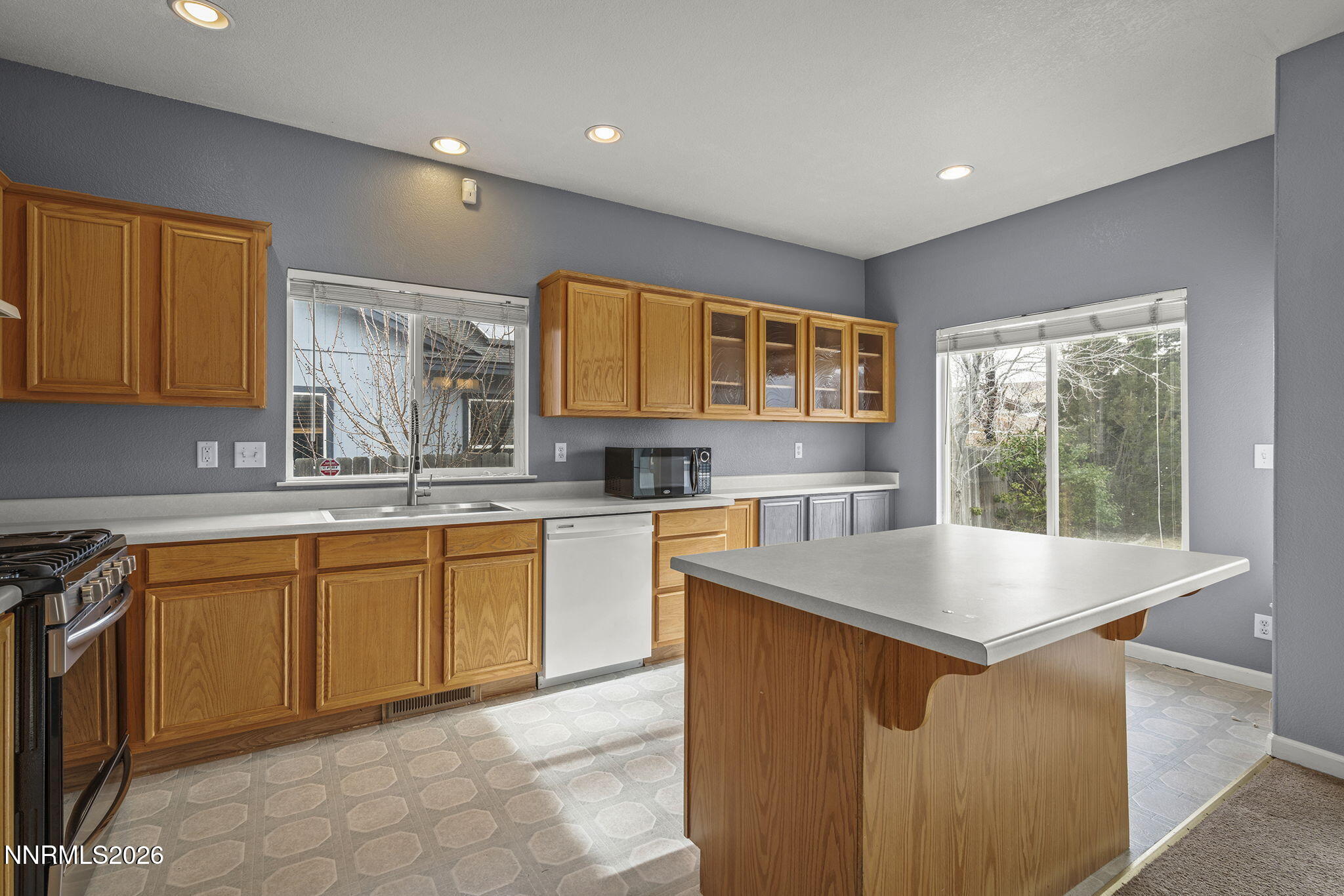 750 West Golden Valley Road Reno, NV 89506 - Photo 11 of 41 a kitchen with stainless steel appliances granite countertop a sink counter space cabinets and a sink