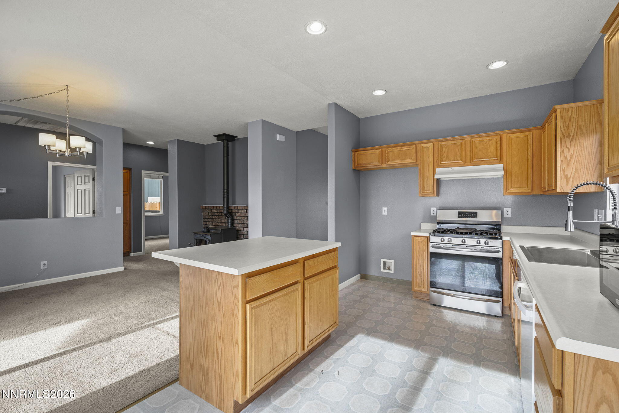 750 West Golden Valley Road Reno, NV 89506 - Photo 13 of 41 a kitchen that has a lot of cabinets in it and wooden floors