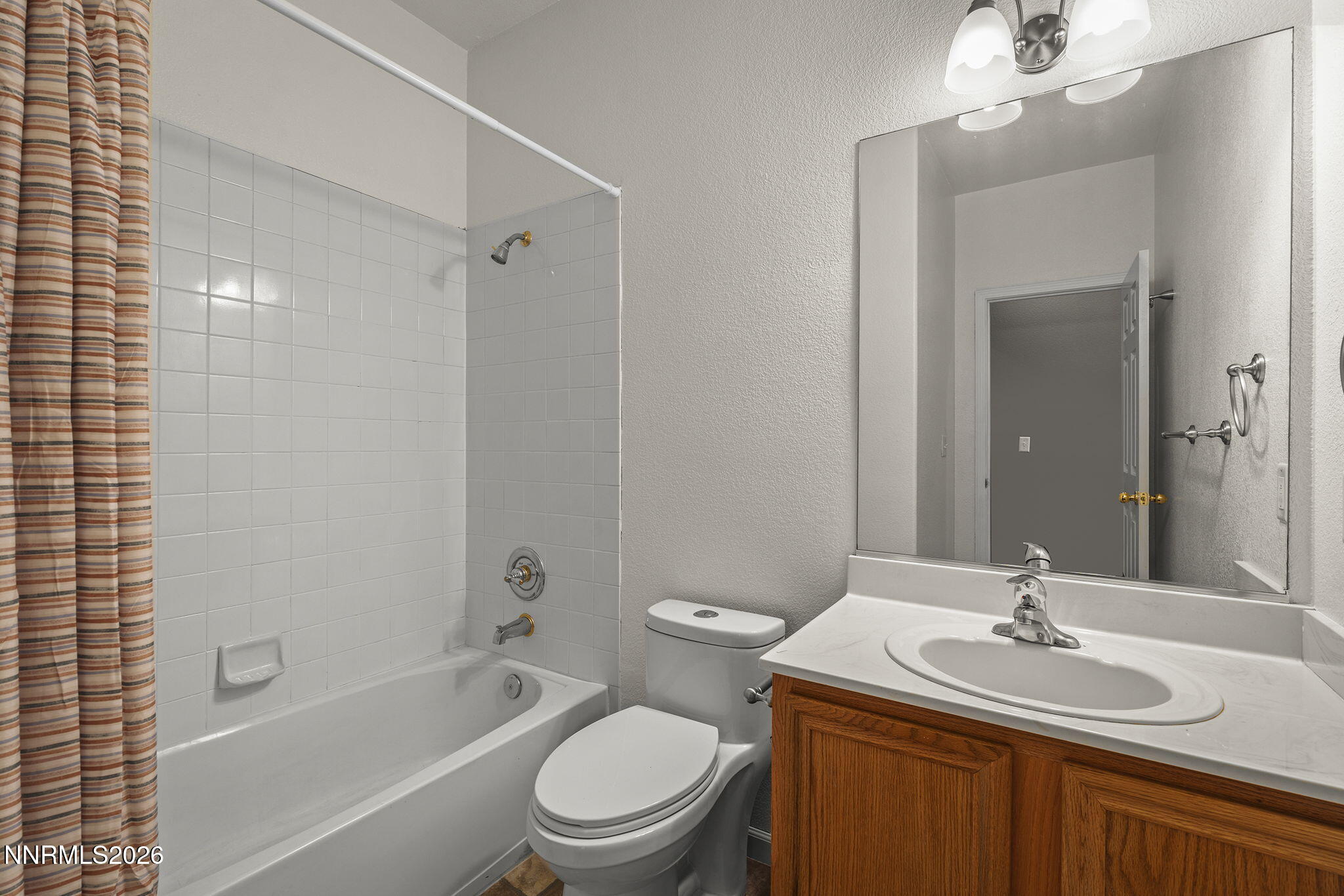 750 West Golden Valley Road Reno, NV 89506 - Photo 23 of 41 a bathroom with a sink a toilet and shower