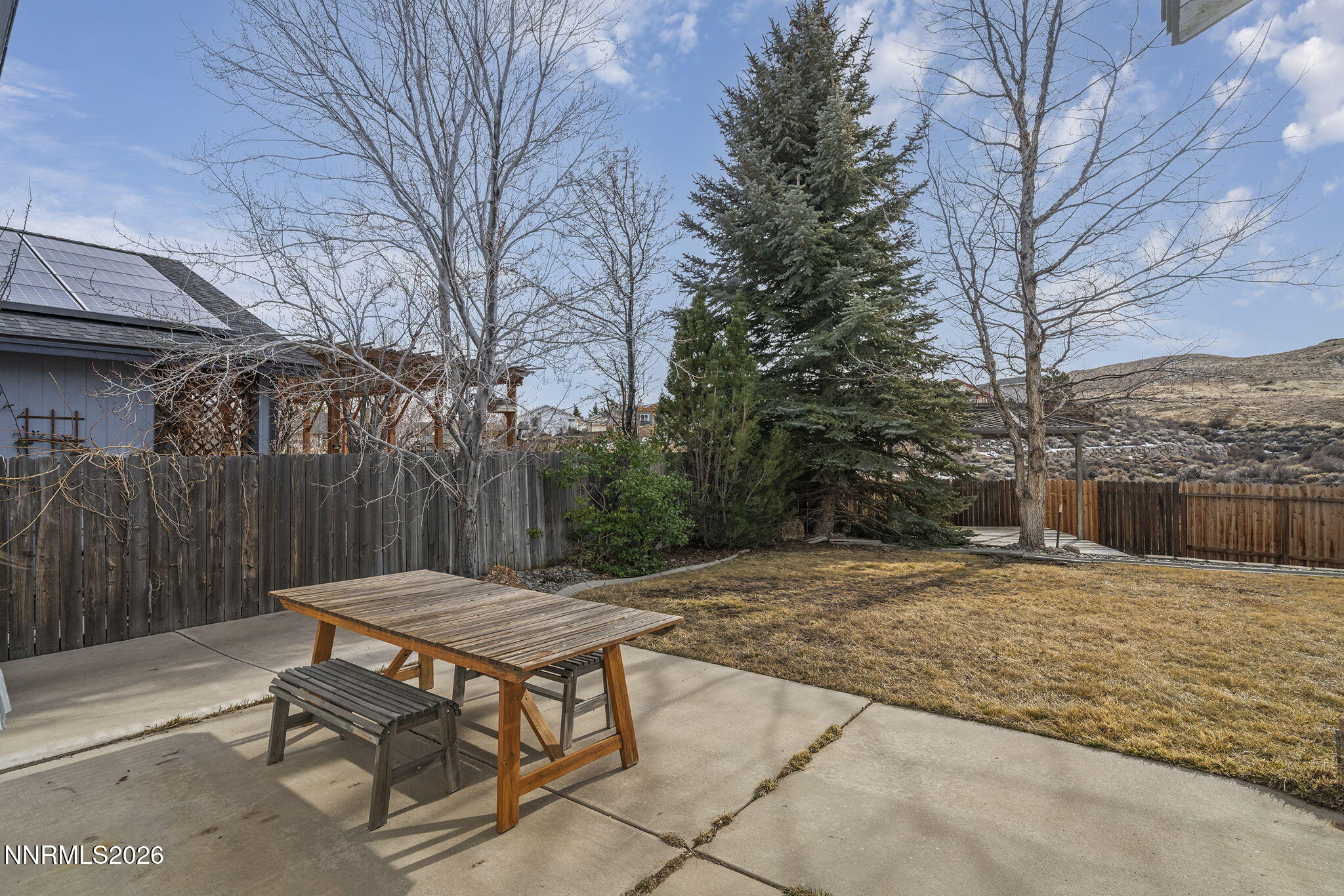 750 West Golden Valley Road Reno, NV 89506 - Photo 25 of 41 a view of a backyard with a table and chairs