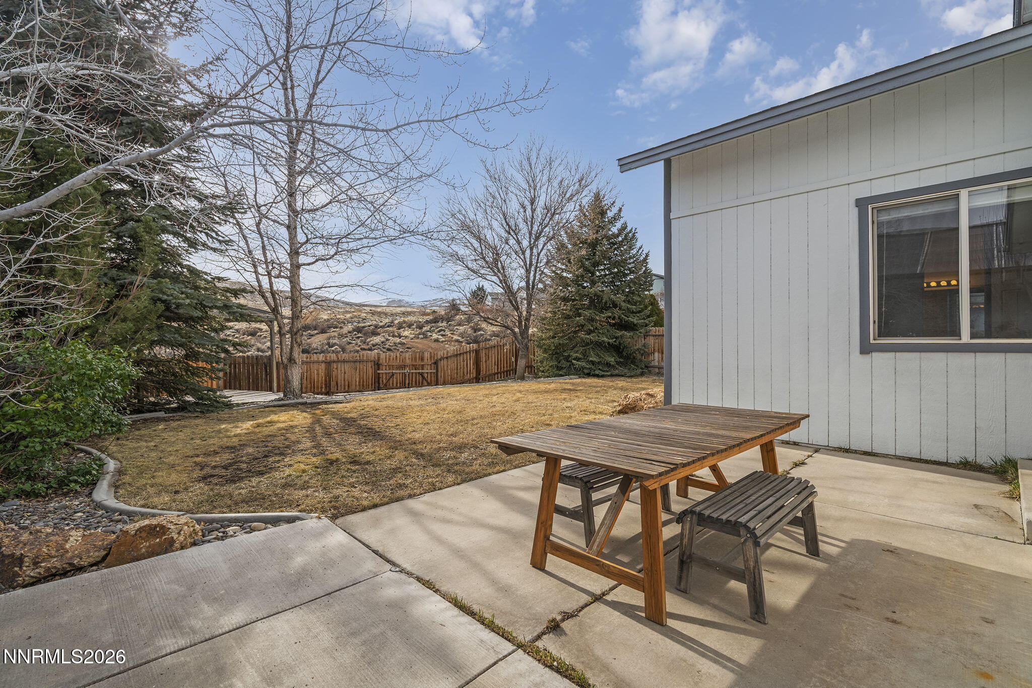 750 West Golden Valley Road Reno, NV 89506 - Photo 26 of 41 a view of a backyard with table and chairs