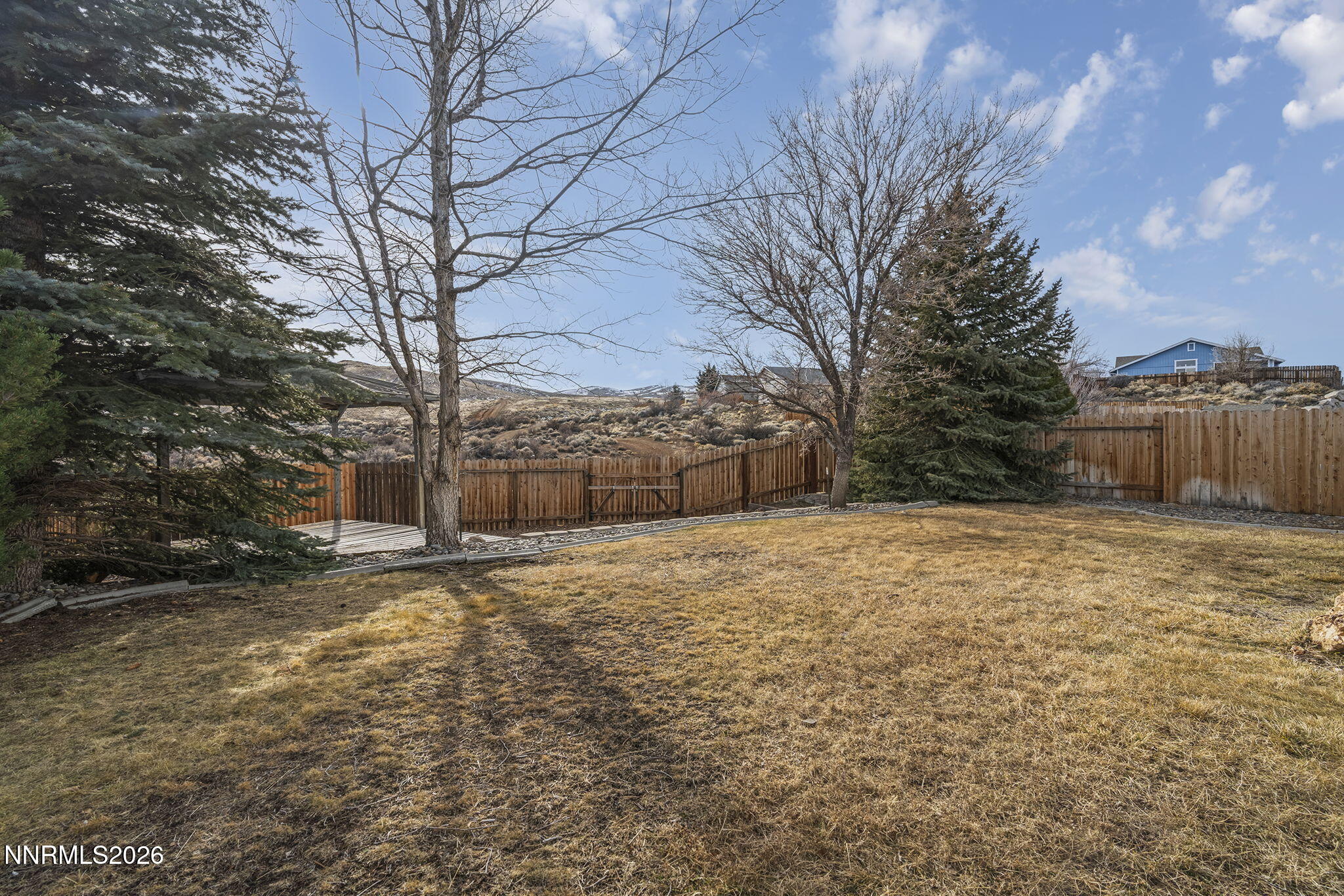 750 West Golden Valley Road Reno, NV 89506 - Photo 27 of 41 a backyard of a house with lots of green space