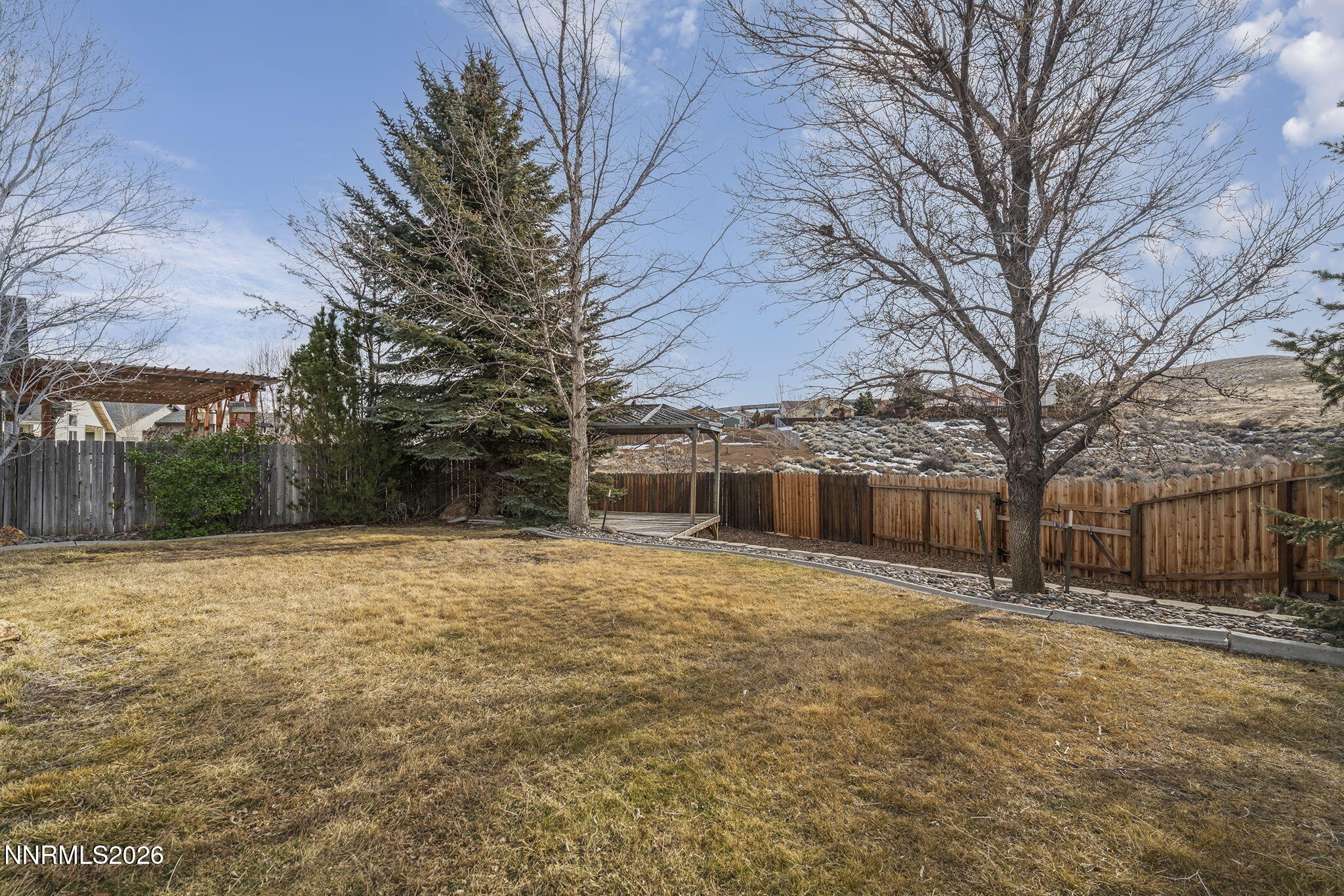 750 West Golden Valley Road Reno, NV 89506 - Photo 28 of 41 a tall house with trees in front of it