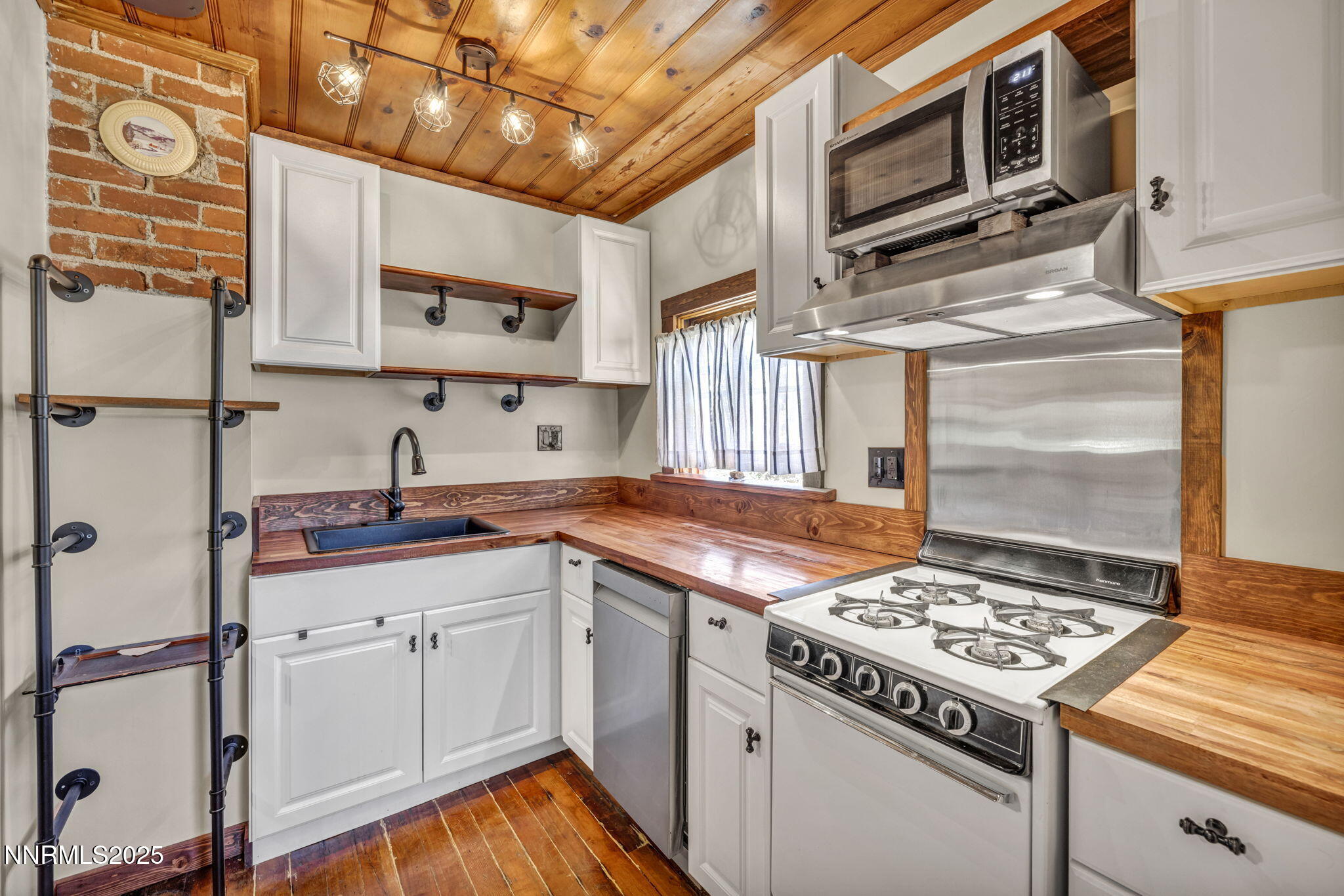 70 4th Street Silver City, NV 89428 - Photo 11 of 29 a kitchen with stainless steel appliances granite countertop a stove and a sink