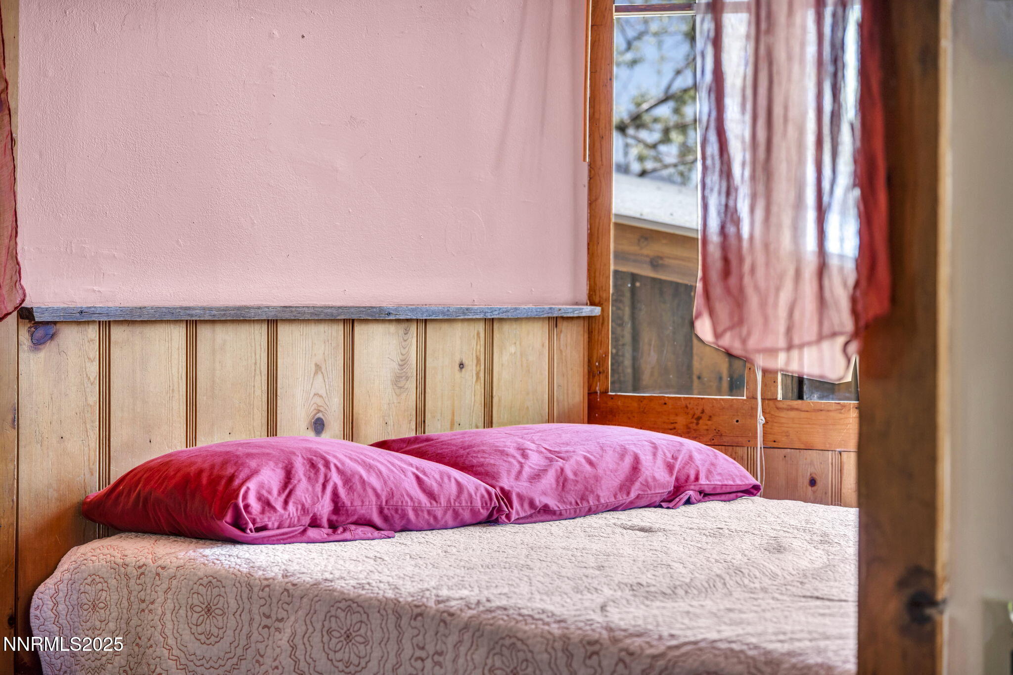 70 4th Street Silver City, NV 89428 - Photo 17 of 29 a bedroom with a large bed and a window