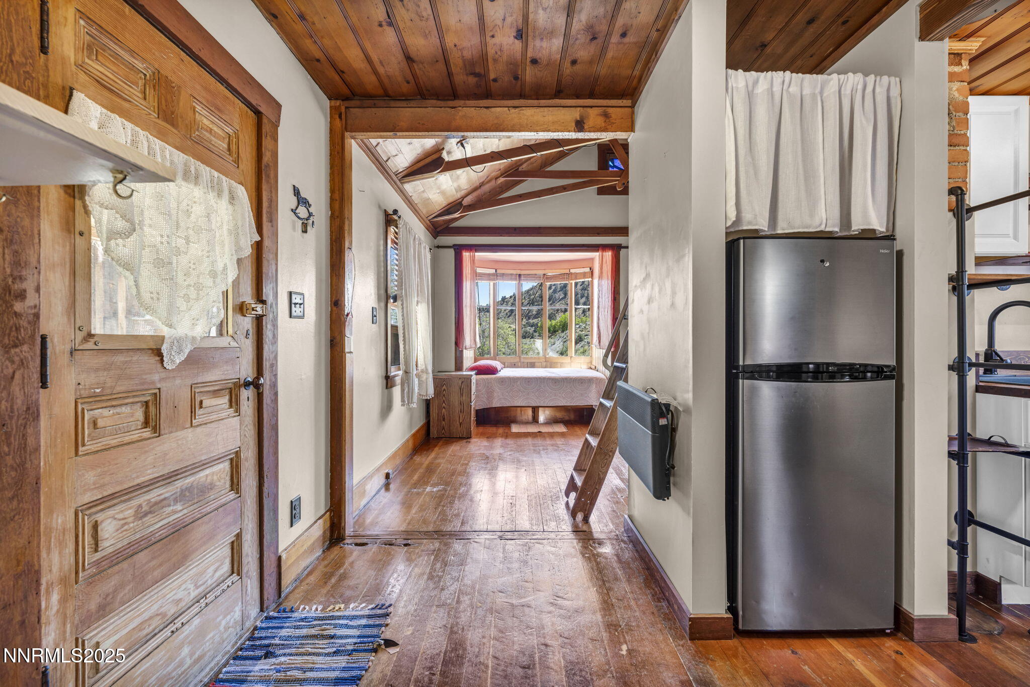70 4th Street Silver City, NV 89428 - Photo 6 of 29 a kitchen with a refrigerator and a wooden floor