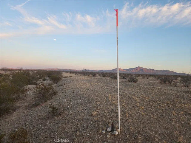 a view of an empty room with mountain view