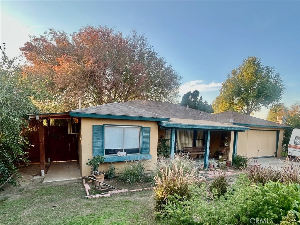 6851 Neil Street Riverside, CA 92504 - Photo 1 of 1 a view of a house with a yard and plants