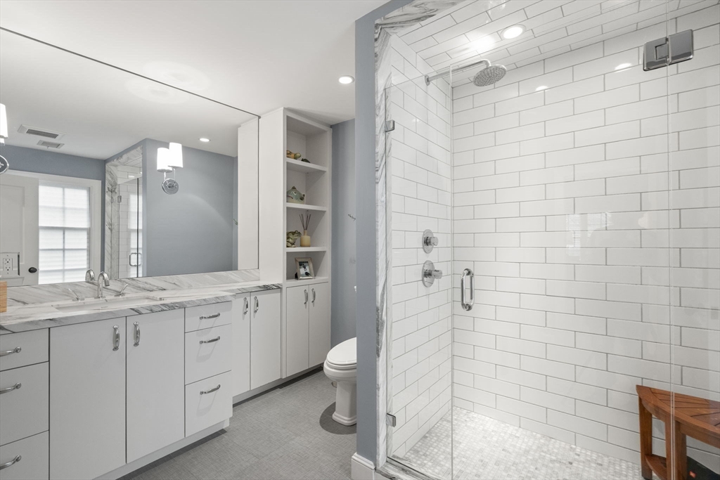 48 Scotch Pine Road Wellesley, MA 02481 - Photo 26 of 39 a bathroom with a granite countertop sink a toilet and shower
