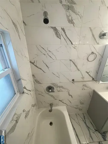 a bathroom with a bathtub