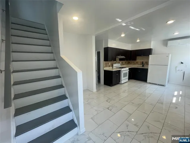 a view of entryway with kitchen