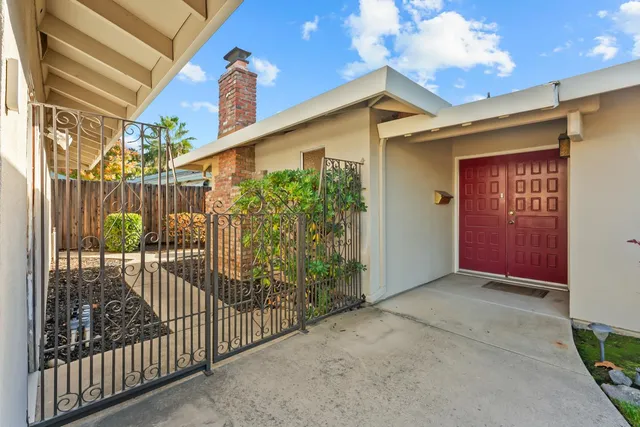 a kitchen with stainless steel appliances granite countertop a refrigerator and stove top oven
