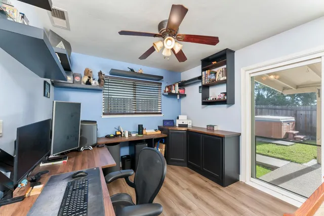 a view of a backyard with sitting area