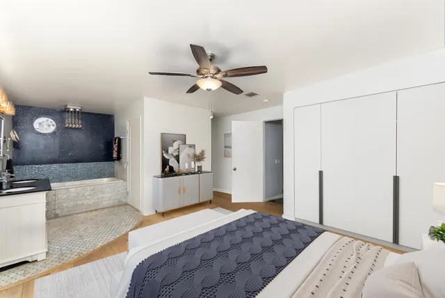 a view of a backyard with table and chairs under an umbrella with a small yard