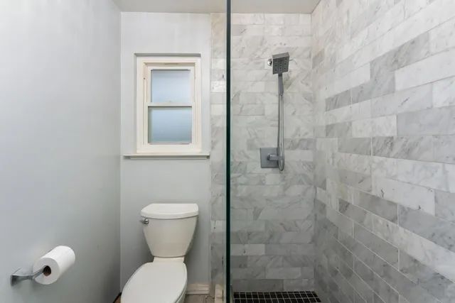 a view of a house with wooden fence