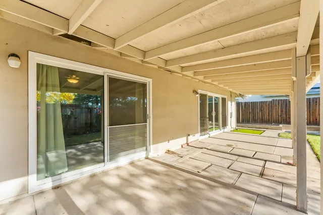 an aerial view of a house with a swimming pool