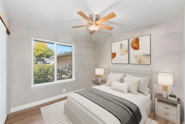 a bedroom with a large bed and a window