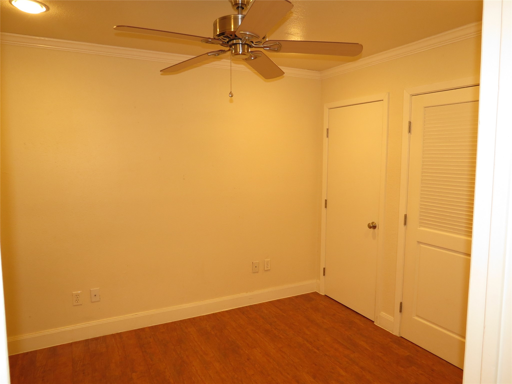 4159 Steck Avenue, Unit 269 Austin, TX 78759 - Photo 9 of 21 Well-lit living space with a ceiling fan and elegant crown molding for comfort.