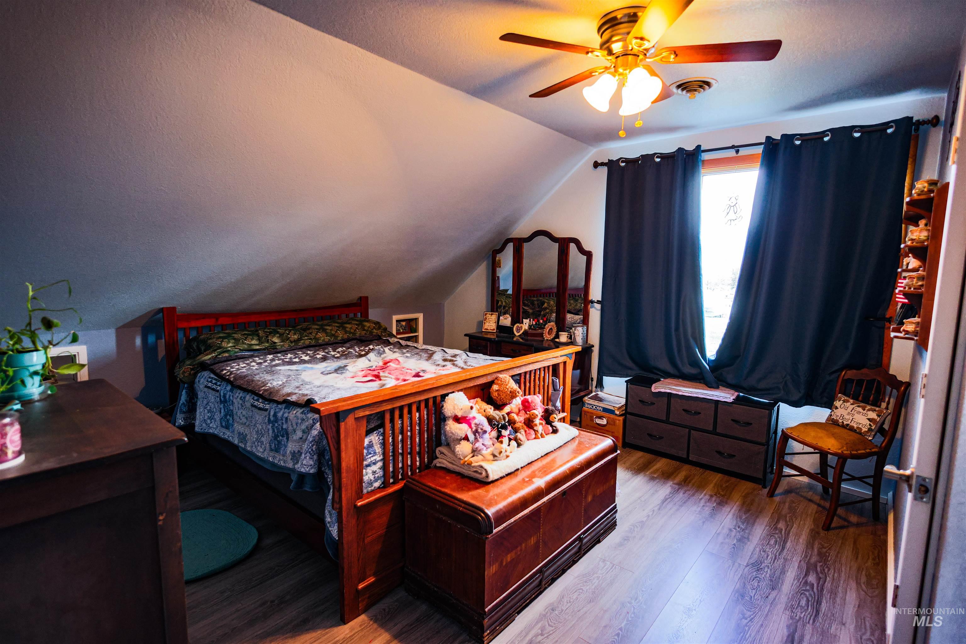 804 Maple Street Kamiah, ID 83536 - Photo 14 of 50 Bedroom with wood finished floors and ceiling fan