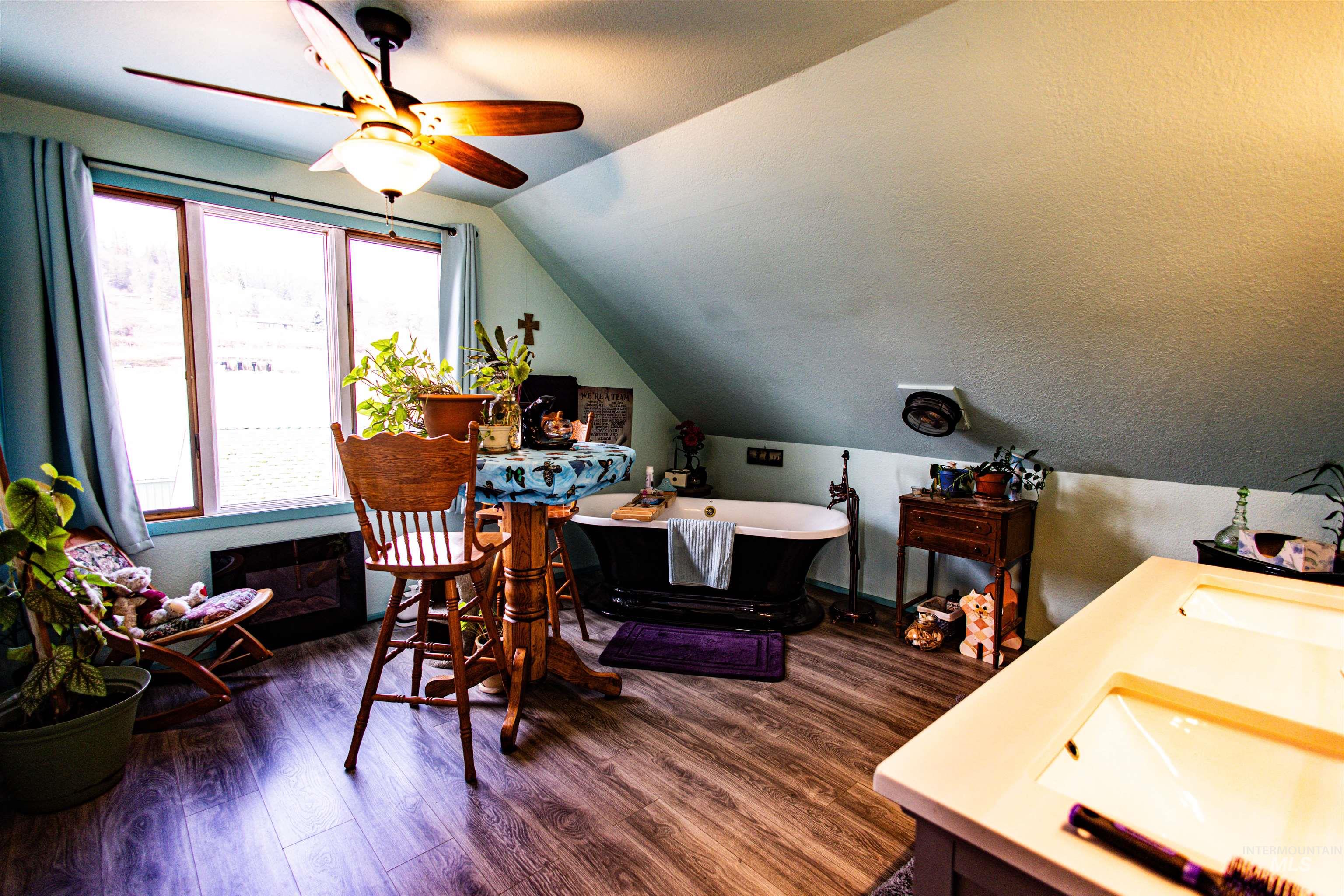 804 Maple Street Kamiah, ID 83536 - Photo 18 of 50 Office area featuring ceiling fan, dark wood-style floors, and lofted ceiling