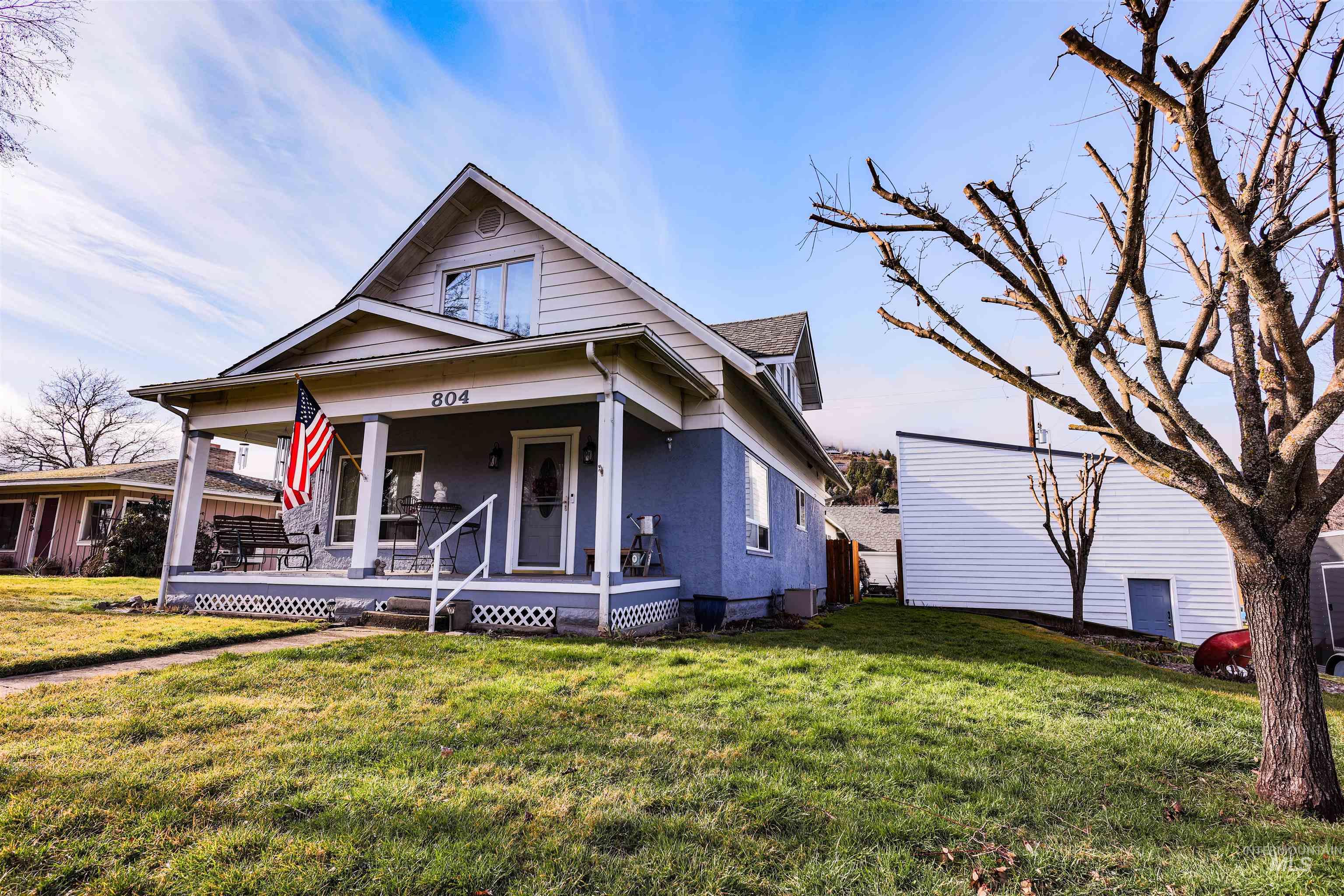 804 Maple Street Kamiah, ID 83536 - Photo 2 of 50 View of front facade with covered porch and a front yard