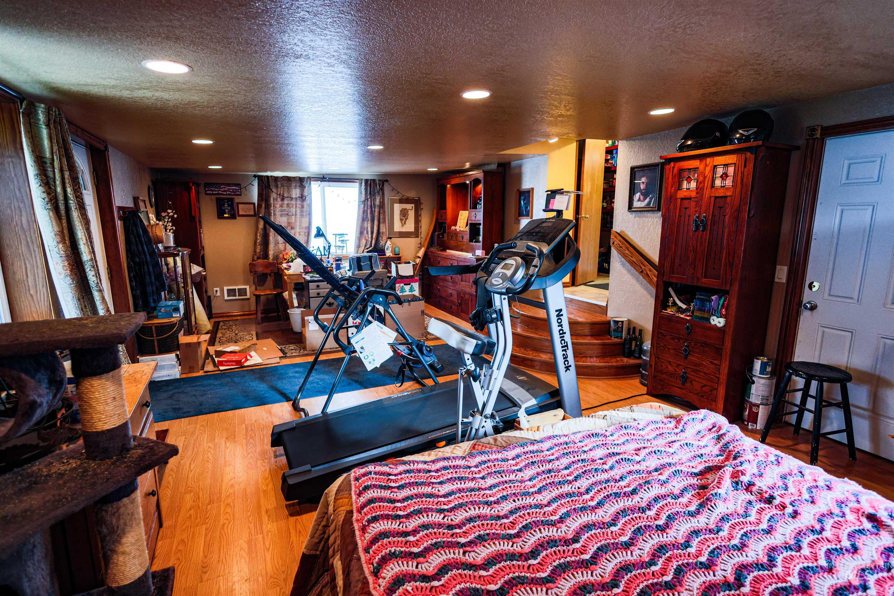 804 Maple Street Kamiah, ID 83536 - Photo 8 of 50 Workout room with a textured ceiling, wood finished floors, and recessed lighting