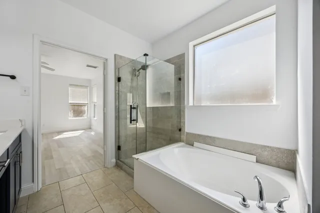 a bathroom with a bathtub and a sink