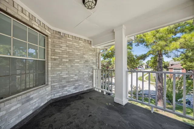a view of outdoor space with wooden floor