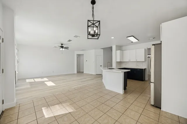 a kitchen with a sink cabinets and window
