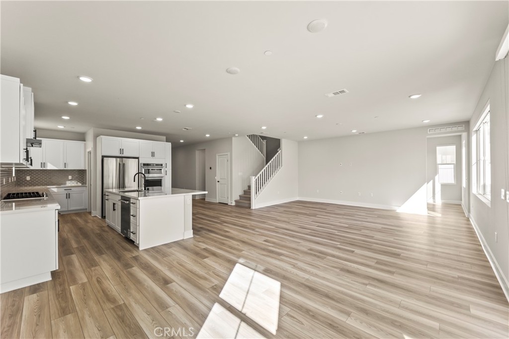 16717 Dara Avenue Chino, CA 91708 - Photo 13 of 41 a living room with furniture and kitchen view