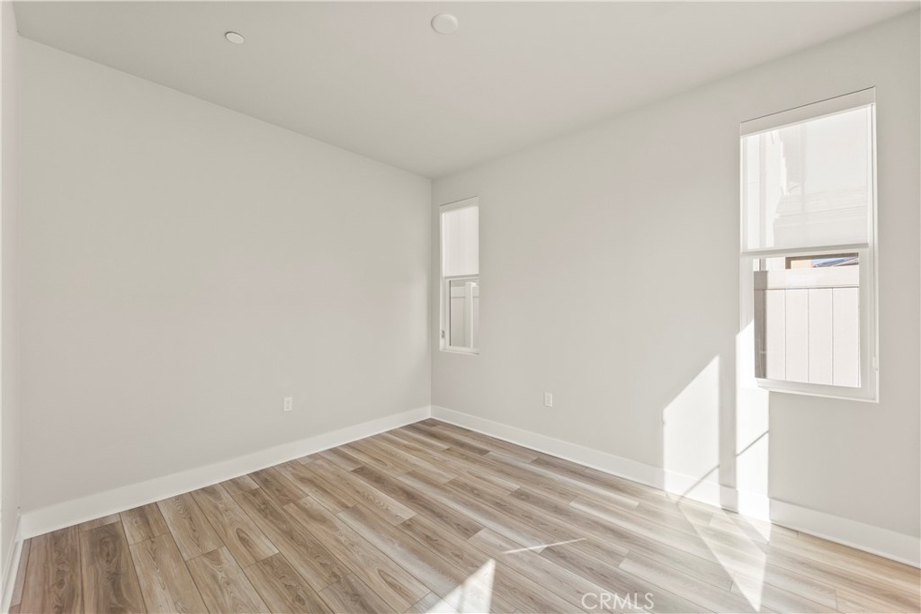 16717 Dara Avenue Chino, CA 91708 - Photo 16 of 41 a view of empty room with wooden floor