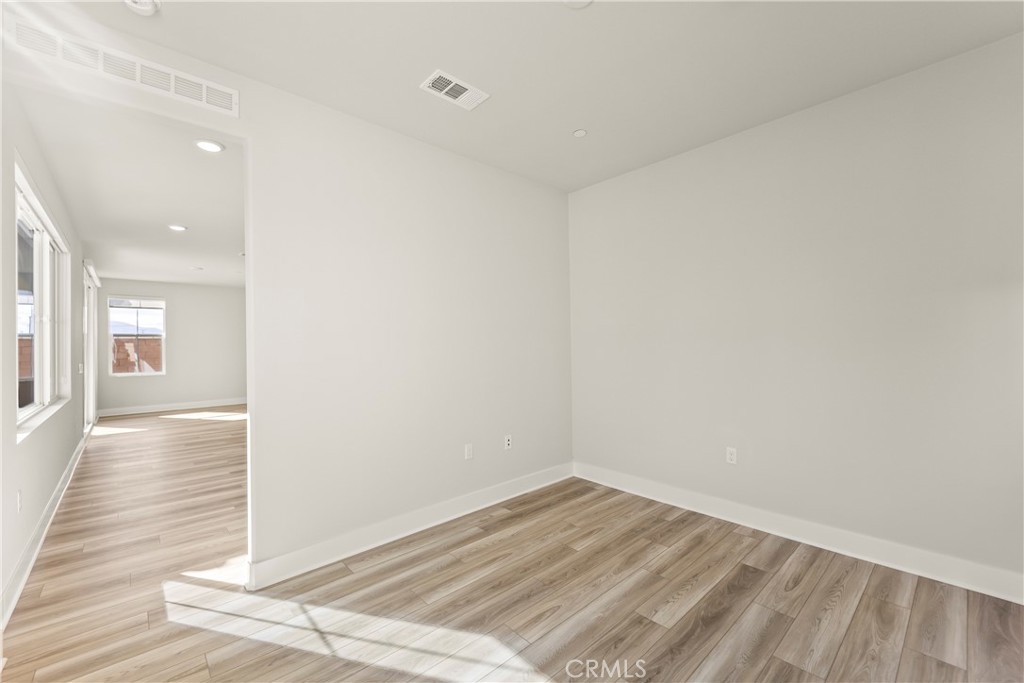 16717 Dara Avenue Chino, CA 91708 - Photo 17 of 41 a view of a room with wooden floor and staircase