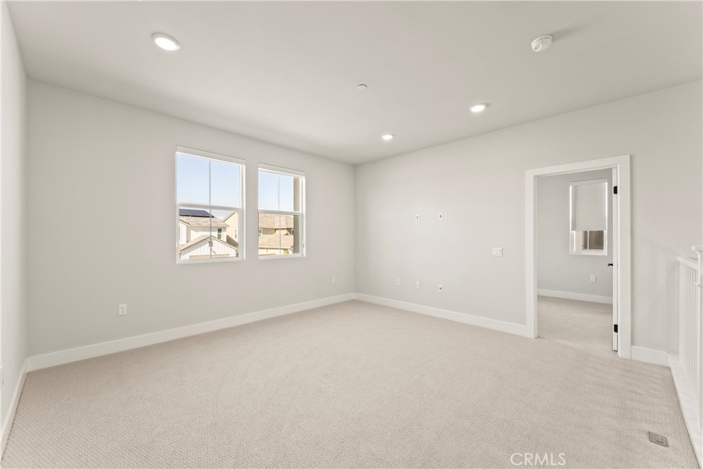 16717 Dara Avenue Chino, CA 91708 - Photo 19 of 41 an empty room with windows and closet